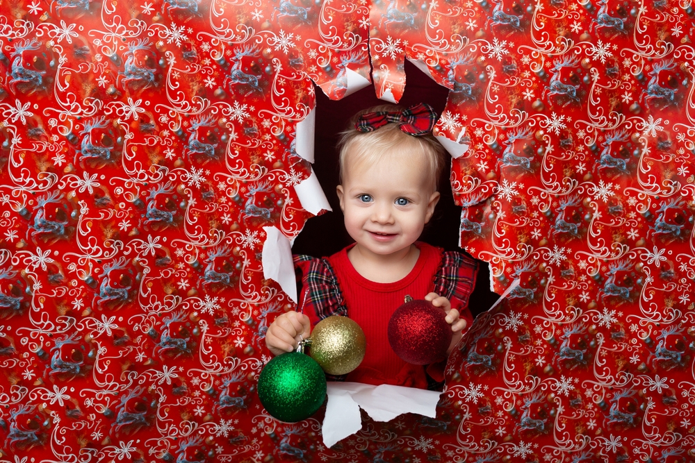 Kalėdinė fotoseija su dovanų popieriumi